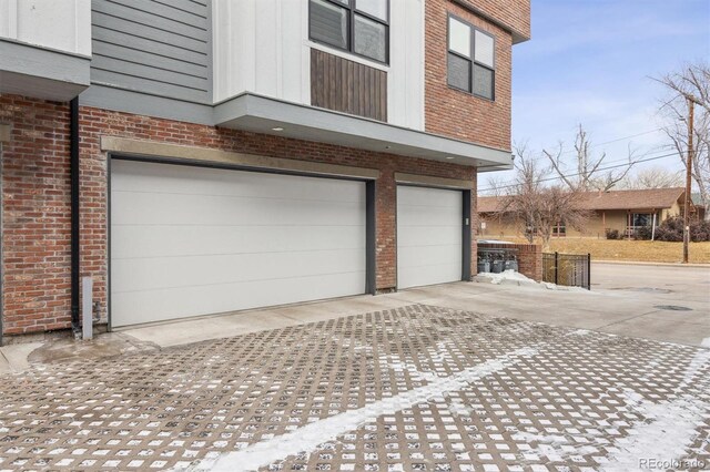 garage featuring concrete driveway