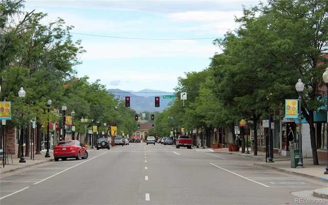 5423 S Prince St Unit B, Littleton, CO 80120 - view of asphalt street featuring traffic lights, curbs, street lighting, and sidewalks
