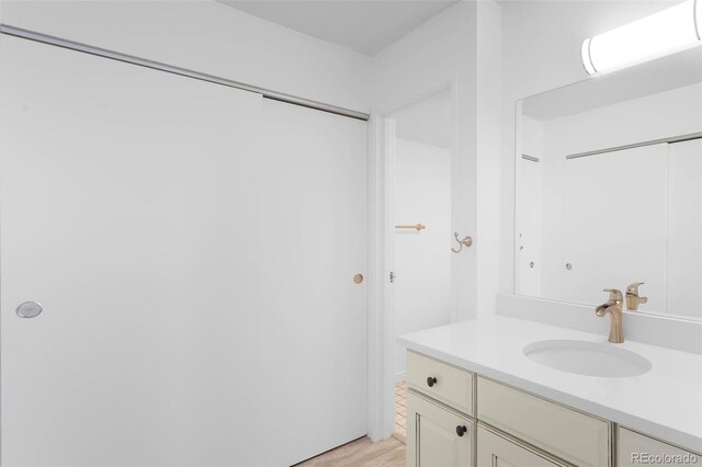 14300 E Marina Dr Unit 306, Aurora, CO 80014 - bathroom featuring vanity and wood finished floors