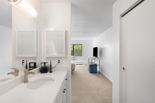 14300 E Marina Dr Unit 306, Aurora, CO 80014 - bathroom featuring vanity, baseboard heating, and a textured ceiling