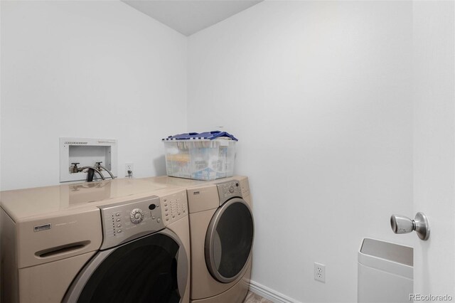 14300 E Marina Dr Unit 306, Aurora, CO 80014 - laundry room with washer and clothes dryer and baseboards