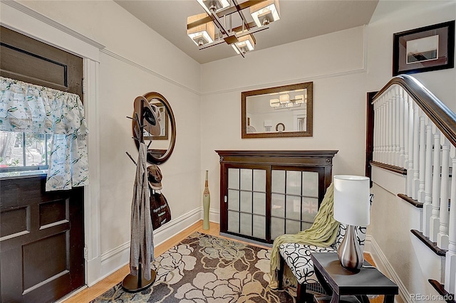 foyer featuring a chandelier and light hardwood / wood-style flooring