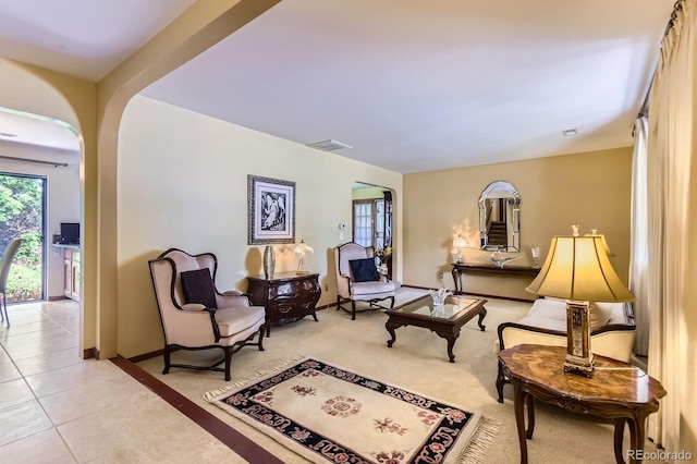 3724 S Poplar St, Denver, CO 80237 - living area with arched walkways and light tile patterned floors