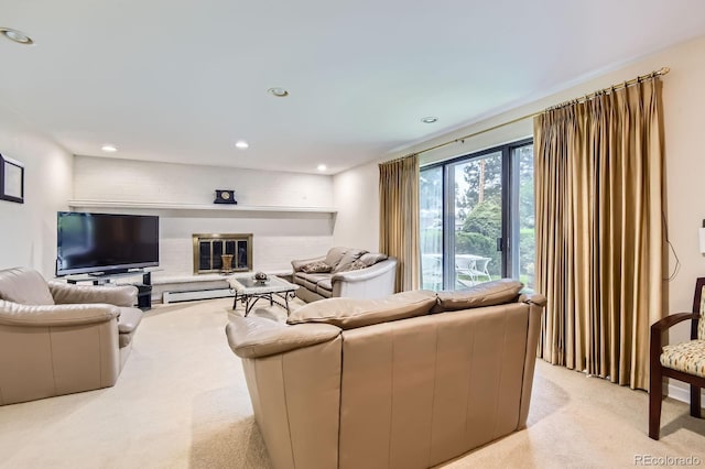 3724 S Poplar St, Denver, CO 80237 - living room featuring light carpet, recessed lighting, a brick fireplace, and baseboard heating