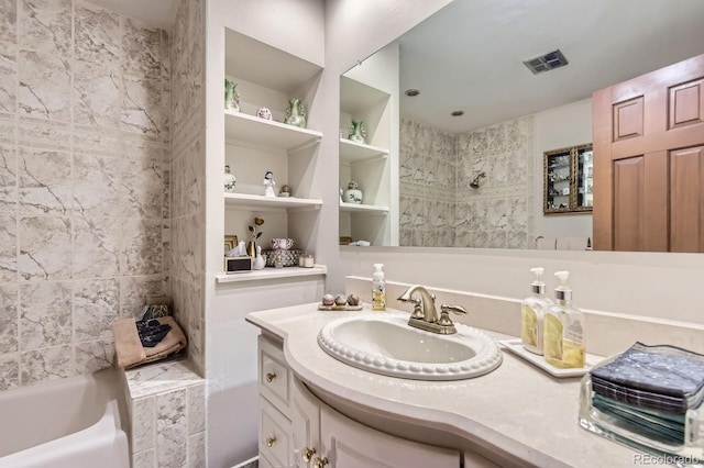 3724 S Poplar St, Denver, CO 80237 - bathroom featuring vanity and bathing tub / shower combination