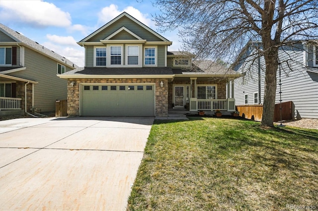 craftsman house featuring a porch, a garage, concrete driveway, a front yard, and stone siding