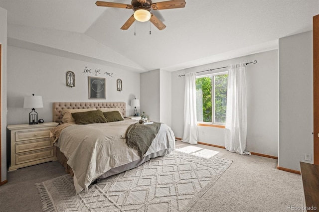 bedroom with lofted ceiling, carpet flooring, baseboards, and a ceiling fan