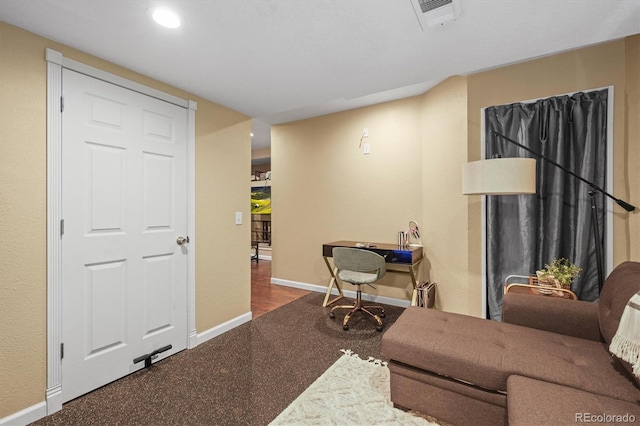 living room with baseboards and recessed lighting