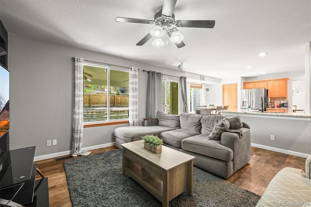 living room with a ceiling fan, dark wood-style floors, baseboards, and recessed lighting
