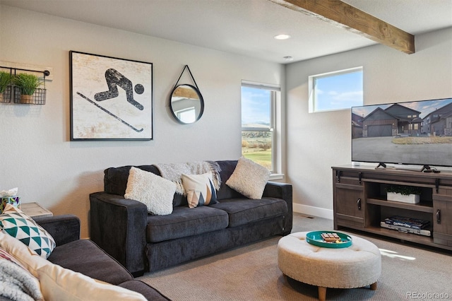 living room featuring beam ceiling and light colored carpet