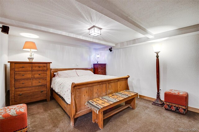 carpeted bedroom featuring beamed ceiling and a textured ceiling