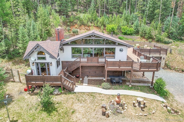 rear view of house with a wooden deck