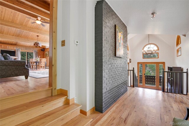 1774 Upper Bear Creek Rd, Evergreen, CO 80439 - entryway featuring a chandelier, wood finished floors, baseboards, stairway, and a ceiling fan