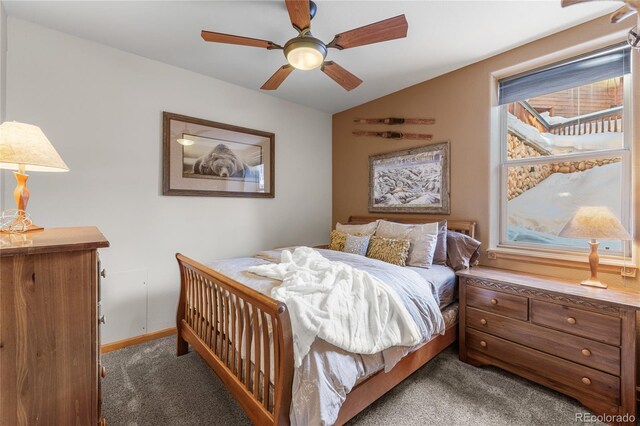 carpeted bedroom featuring vaulted ceiling, a ceiling fan, and baseboards