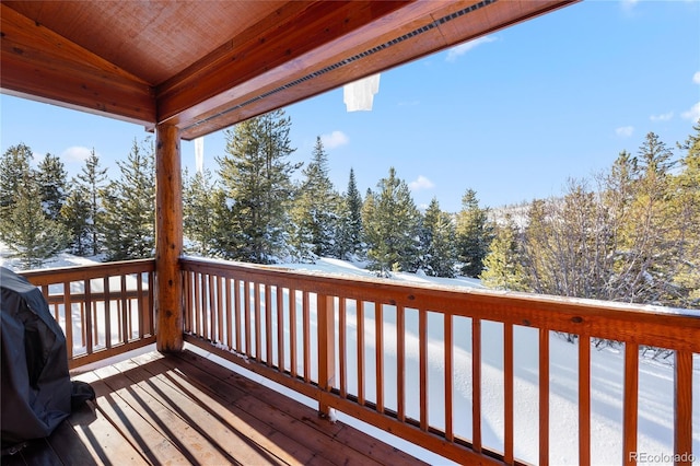 snow covered deck with area for grilling