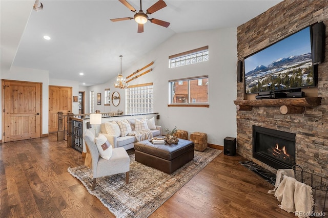 living room featuring a fireplace, recessed lighting, dark wood-type flooring, high vaulted ceiling, and baseboards