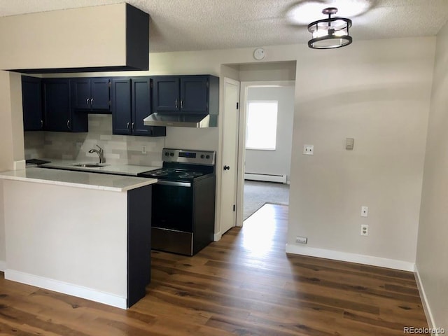 5875 E Iliff Ave Unit 203, Denver, CO 80222 - kitchen featuring electric stove, a sink, under cabinet range hood, baseboard heating, and dark wood-type flooring
