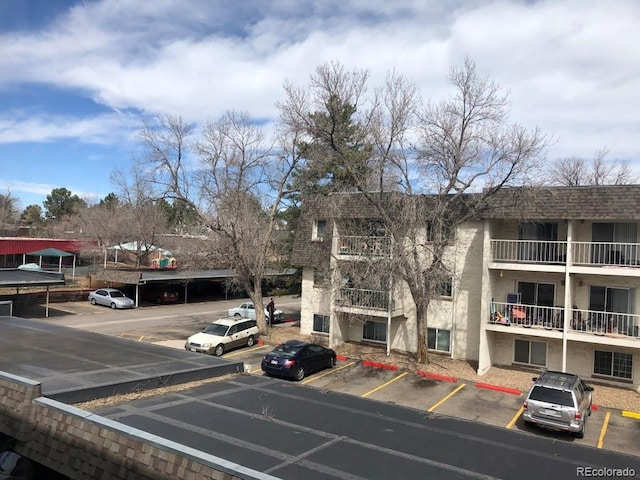 5875 E Iliff Ave Unit 203, Denver, CO 80222 - view of building exterior featuring uncovered parking