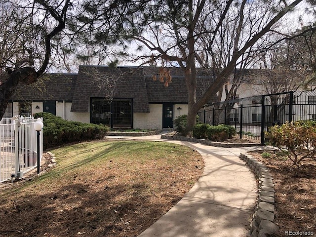 5875 E Iliff Ave Unit 203, Denver, CO 80222 - view of front of property with roof with shingles and mansard roof
