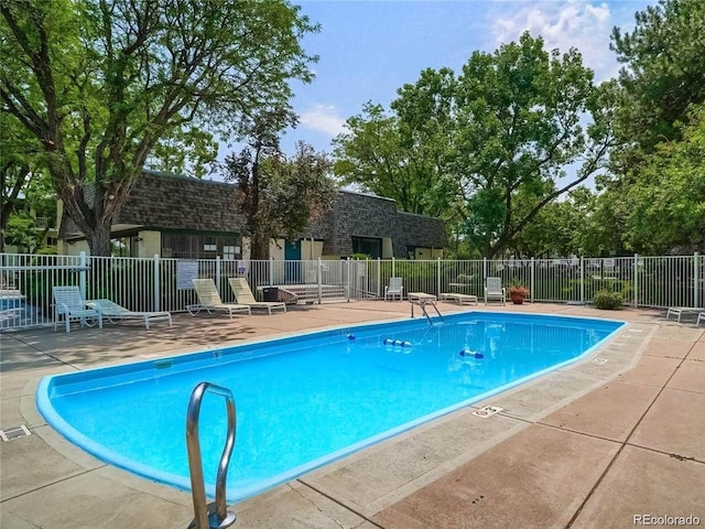 5875 E Iliff Ave Unit 203, Denver, CO 80222 - community pool featuring a patio