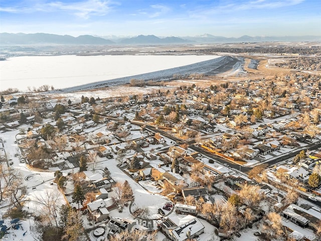 snowy aerial view with a mountain view