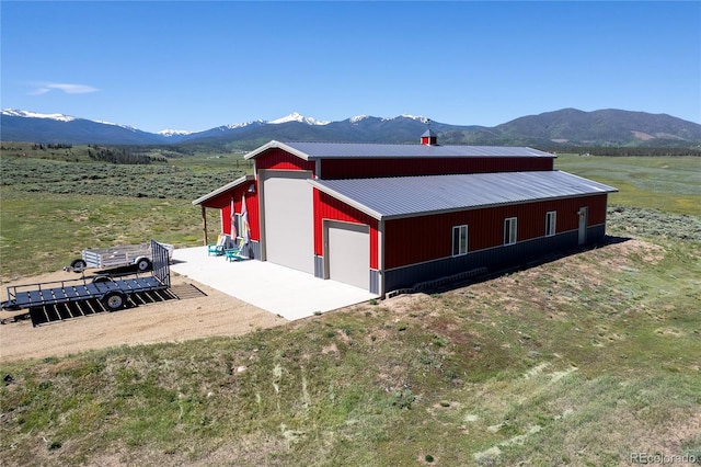 73244 US Highway 40, Tabernash, CO 80478 - view of side of property featuring an outdoor structure, a pole building, a garage, and a mountain view