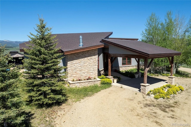73244 US Highway 40, Tabernash, CO 80478 - view of side of home with a patio and stone siding