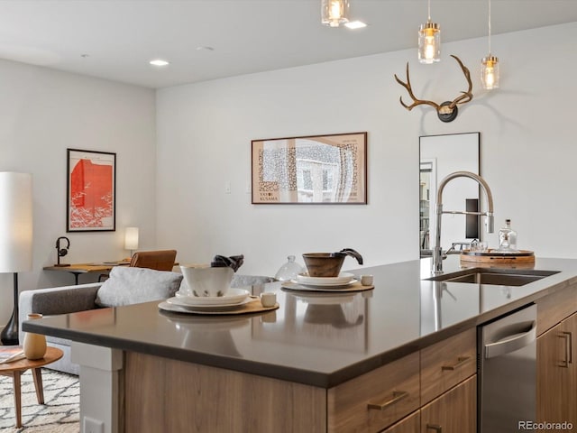kitchen featuring a sink, dark countertops, and brown cabinetry