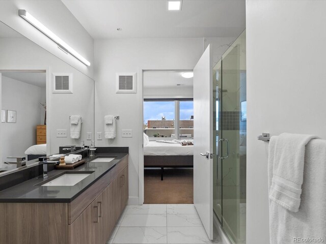 bathroom featuring visible vents, a sink, marble finish floor, and ensuite bath