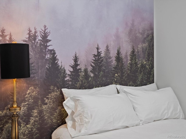 bedroom featuring a wooded view