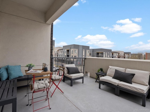 balcony featuring an outdoor living space and a residential view