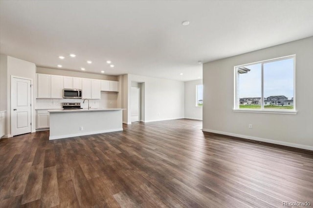 14406 Ranch St, Mead, CO 80504 - unfurnished living room with dark wood finished floors and recessed lighting
