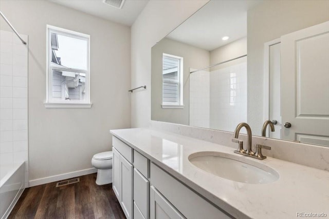 14406 Ranch St, Mead, CO 80504 - full bathroom featuring vanity, wood finished floors, and bathing tub / shower combination