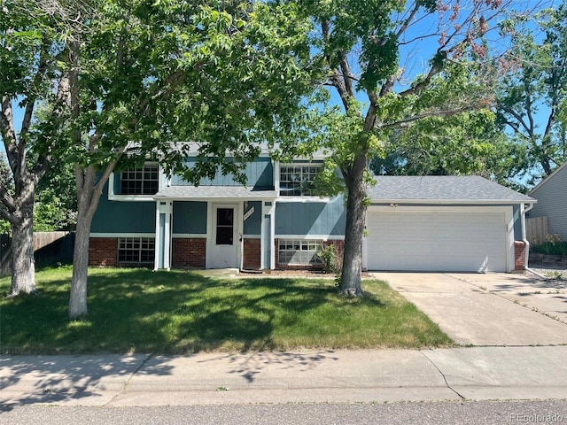 split level home featuring a garage and a front yard