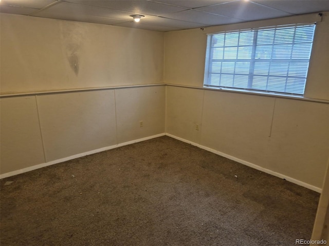 4678 S Lewiston Way, Aurora, CO 80015 - spare room featuring dark carpet, a paneled ceiling, and a decorative wall