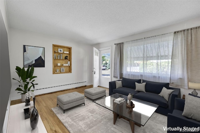 505 Maple St, Golden, CO 80403 - living room with a baseboard heating unit, a textured ceiling, and wood finished floors