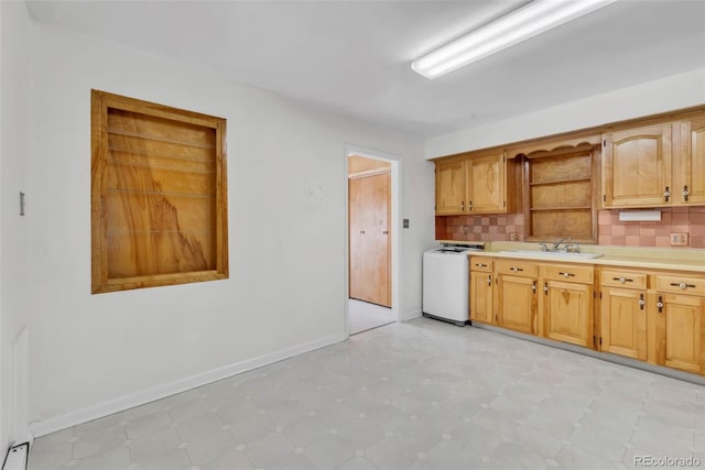 505 Maple St, Golden, CO 80403 - kitchen featuring washer / clothes dryer, open shelves, light flooring, light countertops, and decorative backsplash