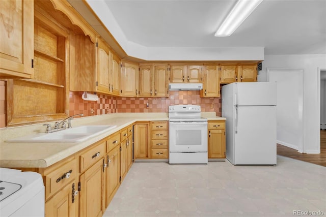 505 Maple St, Golden, CO 80403 - kitchen with white appliances, under cabinet range hood, light countertops, and tasteful backsplash