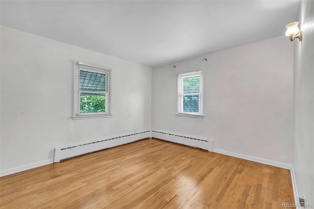505 Maple St, Golden, CO 80403 - unfurnished room featuring baseboard heating and light wood-style flooring