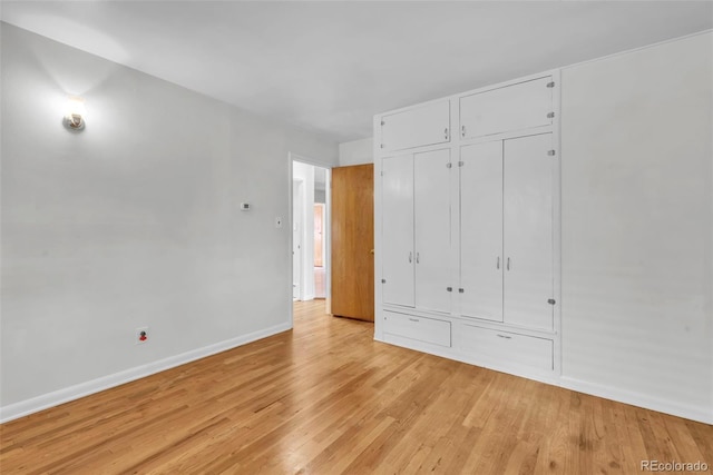 505 Maple St, Golden, CO 80403 - unfurnished bedroom featuring light wood-type flooring and two closets