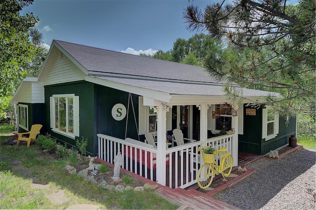 80 Meadow Ln, Bailey, CO 80421 - view of front facade with a porch and roof with shingles