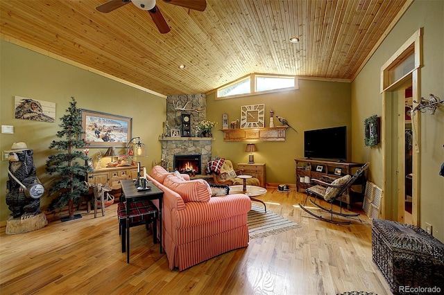 80 Meadow Ln, Bailey, CO 80421 - living area with ceiling fan, ornamental molding, a stone fireplace, lofted ceiling, and wood finished floors