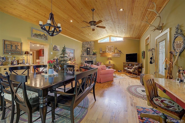 80 Meadow Ln, Bailey, CO 80421 - dining area featuring vaulted ceiling, a fireplace, ceiling fan, wood ceiling, and light wood-type flooring