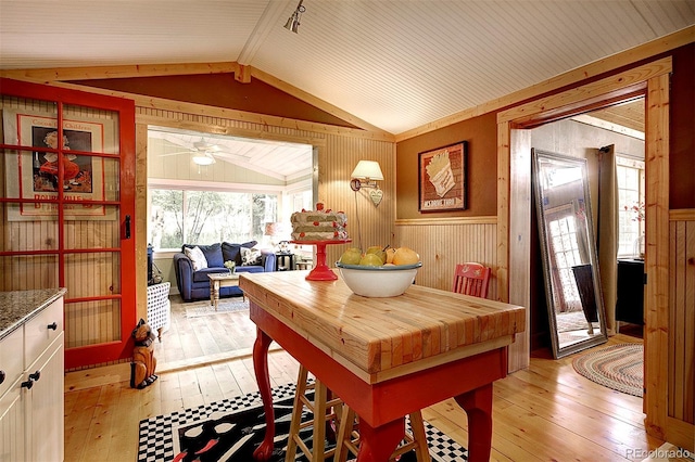 80 Meadow Ln, Bailey, CO 80421 - dining space with wooden walls, light wood-style flooring, wainscoting, and ceiling fan