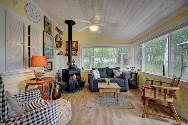 80 Meadow Ln, Bailey, CO 80421 - sunroom with a wood stove, vaulted ceiling, hardwood / wood-style flooring, wood ceiling, and a wooden deck