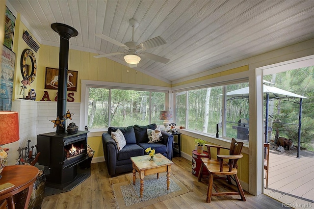 80 Meadow Ln, Bailey, CO 80421 - sunroom / solarium with a wood stove, vaulted ceiling, a deck, wood ceiling, and wood-type flooring