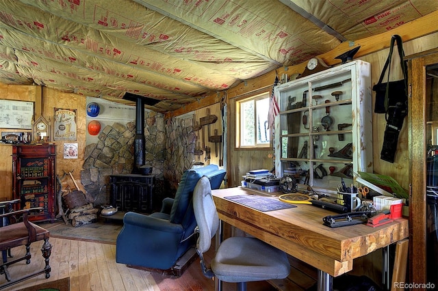80 Meadow Ln, Bailey, CO 80421 - office area with a wood stove, hardwood / wood-style floors, and wooden walls