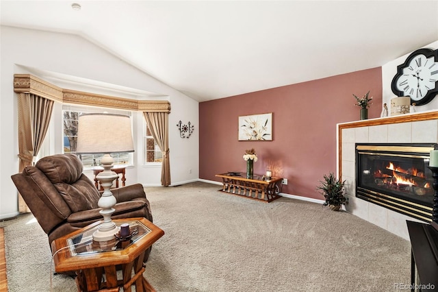 carpeted living room featuring lofted ceiling and a fireplace