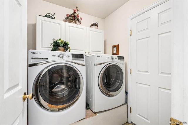 washroom with cabinets and separate washer and dryer