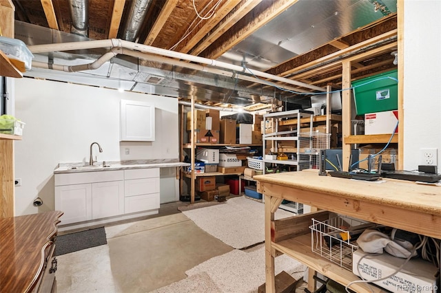 basement with sink and a workshop area